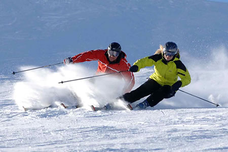 man and women skiing