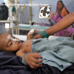 A child suspected to be suffering from Dengue fever, caused by the aedes mosquitoes, receives treatment at the Childrens Hospital in Allahabad, India, Wednesday, Aug. 29, 2007. Health officials had warned of the risks of skin infections, malaria, leptospirosis and dengue fever after flood water caused by monsoon rains receded. (AP Photo/Rajesh Kumar Singh)