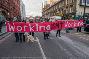 London, UK. 4th March, 2016. Campaigners from the Mental Health Resistance Network and DPAC block traffic on the busy Old St round in portest against the use of Maximus job coaches in GP surgeries to "create jobs by prescription." They say disabled people will be bullied into unsuitable work and lose benefits through sanctions. Peter Marshall/Alamy Live News